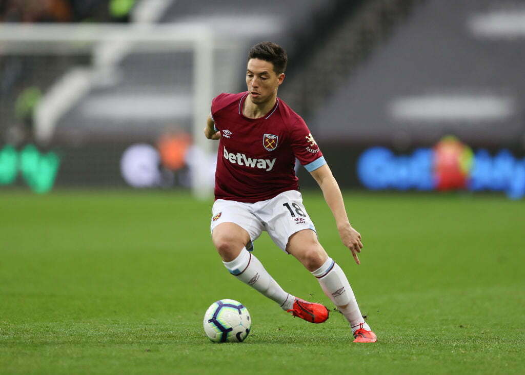 West Ham’s forgotten man Carlos Sanchez pictured back in schooling